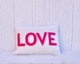 Love eco-friendly pillow.  Pink and white burlap pillow with embroidered up-cycled wool cashmere letters.