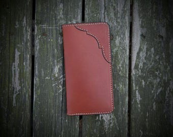 May include: A rectangular brown leather wallet featuring a smooth finish and a decorative curved stitched edge detail along the top right corner. The wallet is constructed with visible light-coloured thread stitching along the perimeter.