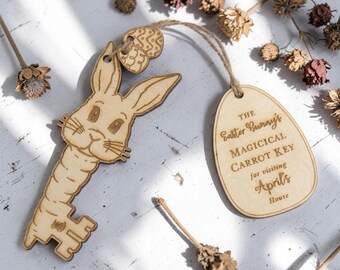May include: Wooden Easter Bunny key with a carrot-shaped handle and a tag that reads "The Easter Bunny's Magical Carrot Key for visiting April's House." The key and tag are connected with twine and decorated with a small egg.