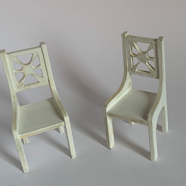 2 Retro 1:12 scale dining/side chairs. These adorable chairs are finished in shabby chic white. Made from Baltic birch. 1.5” x 1.5” x 3”