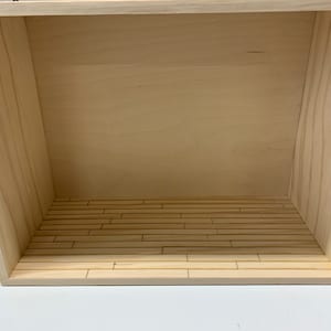 Shadow box room vignette 13”x 6” x 10” Sturdy display shelf for 1:12 scale miniatures. Handmade with engraved flooring. Unfinished