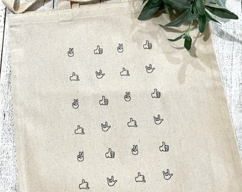 Hand signs beige canvas bag