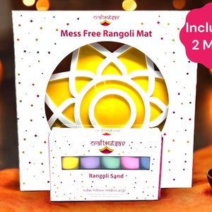 May include: A white box with a yellow and white mandala design on the front. The box says "Craft Utsav Mess Free Rangoli Mat" and "Includes 2 Mats". A smaller white box with a colorful set of rangoli sand is in front of the larger box. The smaller box says "Craft Utsav Rangoli Sand - India's culture modern style."