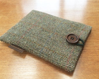 May include: A green and brown tweed fabric case with a brown button and a brown leather tag that says "Nuthatch Designs".