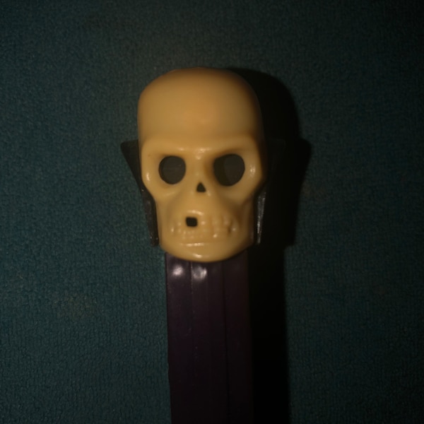 Skull “A” Pez Dispenser with Thin Feet, Brown Sleeve, Made in Yugoslavia Hard to Find