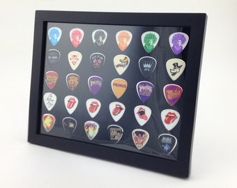 Expositor de púas de guitarra, color negro, 20,3 x 25,4 cm, doble cara, horizontal, capacidad para 30 púas de guitarra, MARCO INCLUIDO