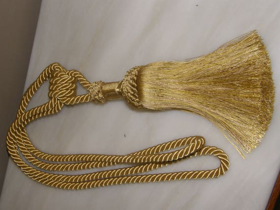 fermatenda in corda argento per tende da drappeggio colore argento e oro Fermatenda per tende con nappa