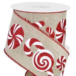 May include: Red and white candy cane and peppermint patterned ribbon on a beige burlap background. The ribbon has a red glitter finish.