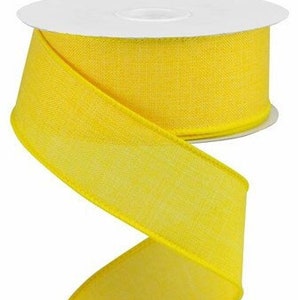 May include: A spool of bright yellow wired ribbon. The ribbon is 2.5 inches wide and has a satin finish.