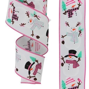 May include: White ribbon with pink trim featuring a repeating pattern of snowmen wearing hats, scarves, and plaid shirts. The snowmen are holding pine branches and pine cones.