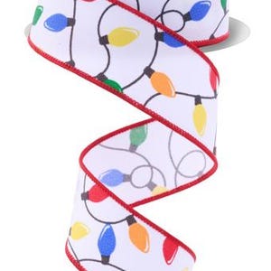 May include: A roll of white ribbon with a repeating pattern of colorful Christmas lights. The lights are red, green, blue, and yellow, outlined in black. The ribbon has a red stitched edge. The spool has the text "RG Ribbon" on it.