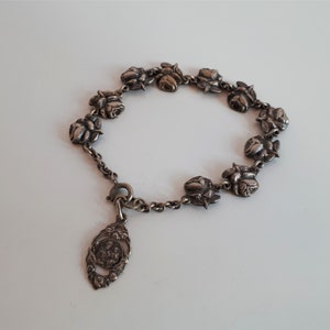 Antique Saint Joseph Oratory of Mount Royal Montreal silver metal religious saint medal and roses panel link bracelet with charm