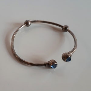 Vintage signed sterling silver 925 cuff bracelet with ball ends with encrusted simulated blue sapphire slide ball beads