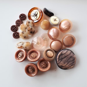 Collection of rare Art Deco era vintage mixed dusty pink cream brown molded plastic collectible buttons sewing craft jewelry make