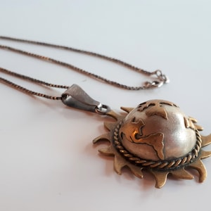 OOAK Vintage brass and sterling silver figural globe in the sun with continents harmony pendant necklace