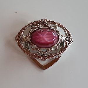 Vintage Edwardian revival silver tone metal filigree oval scarf clip with faux pink star sapphire glass cabochon, scarf clip,