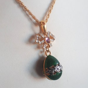Vintage Belle Epoque revival green iridescent enamel egg pendant necklace with bow with gripoix amethyst glass cabochon gold plate chain