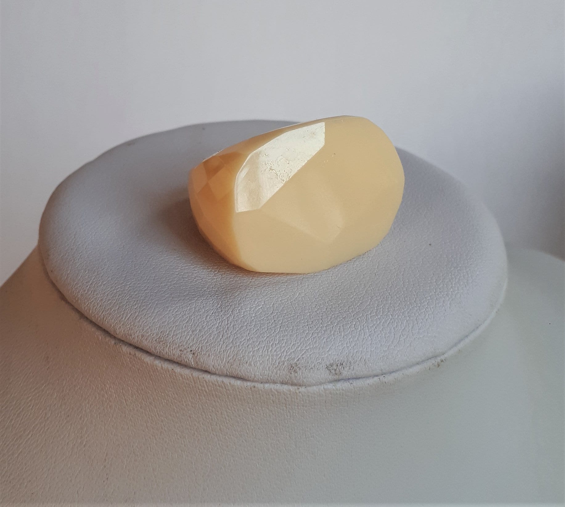 Statement cream lucite plastic ring signed BCBGMAXAZRIA huge massive hand faceted irregular shape oval top