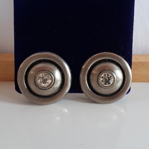 Big chic Vintage satin finish silver colored metal and rhinestone round domed clip earrings