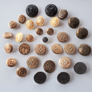 Huge Collection of vintage silver and gold tone metal mixed buttons heraldic coat of arms military faux coin design