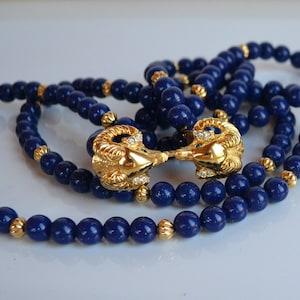 Vintage KJL Kenneth Jay Lane signed blue resin plastic gold metal 2 ram heads encrusted rhinestone statement Necklace