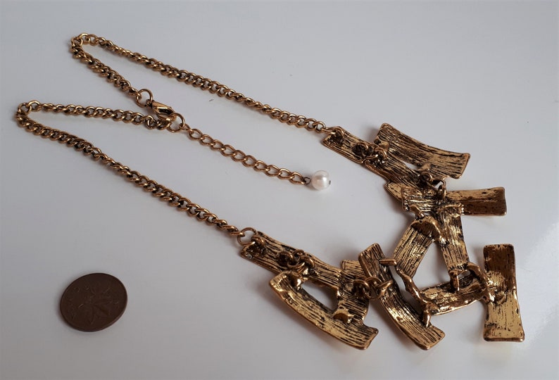 Designer modernist gold metal bib necklace Big Vintage textured gold tone metal sculptural bib necklace sculptural necklace,