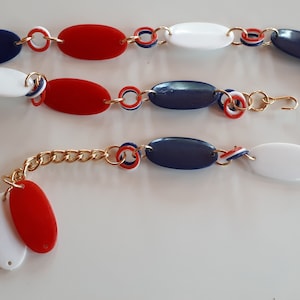 Patriotischer Kunststoffgürtel, Vintage patriotischer rot weiß blauer Kunststoff Gürtel mit großen ovalen elementen,