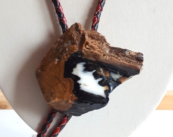 Unique Vintage genuine petrified wood wolf head bolo tie leather cord