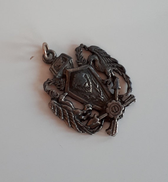 Big Antique Coat of arms metal pendant with griffi