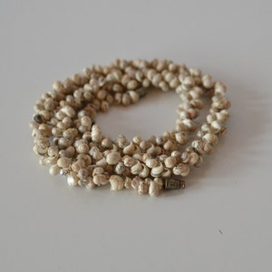 Vintage very tiny natural white with fine brown motif miniature shell torsade necklace