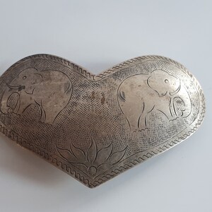 Vintage silver colored metal heart shape hair barrette with hand etched elephants