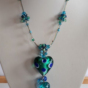 Blue green foil glass lampwork puffy heart lavalier pendant necklace with blue shades glass charms