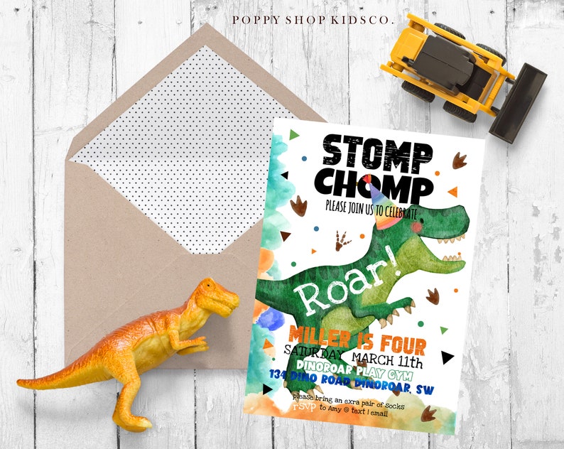May include: A green dinosaur with a party hat and the words "Stomp Chomp" and "Roar!" on a white background. The text "Miller is Four" and "Saturday March 11th" is also on the invitation. The invitation is for a dinosaur themed birthday party.