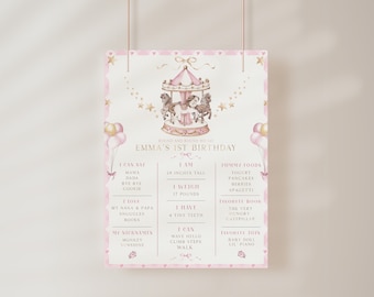 Peut inclure: Une affiche imprimable rose et or pour un premier anniversaire avec une illustration de carrousel. L'affiche comprend des détails sur l'enfant, tels que son âge, sa taille, son poids et ses choses préférées. Le texte indique "Round and round we go, Emma's 1st Birthday".