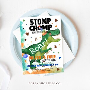 May include: A colorful dinosaur birthday party invitation with a green dinosaur wearing a party hat and the text "Stomp Chomp Roar! Miller is Four Saturday March 11th DinoRoar Play Gym 134 Dino Roar Dinoroar, SW".