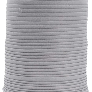 May include: A spool of gray fabric trim. The trim is rolled up and is about 1 inch wide.