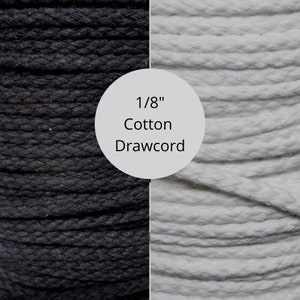 May include: 1/8" cotton drawcord in black and white. The drawcord is a tightly woven, twisted cord.