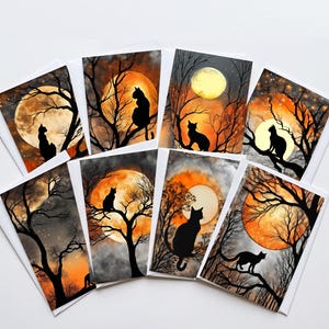 May include: A collection of seven rectangular greeting cards featuring black cat silhouettes perched on bare tree branches against large, glowing orange and yellow full moons. The dark, atmospheric scenes include starry night skies and clouds.