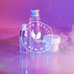 May include: Three clear glass bottles with a white label that says "Evo Beauty A New Kind" in a circle. The bottles are on a iridescent surface with a pink and purple background. There is white smoke in the background.
