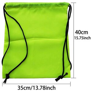 May include: A bright green drawstring bag with black drawstrings. The bag measures 15.75 inches tall and 13.78 inches wide.