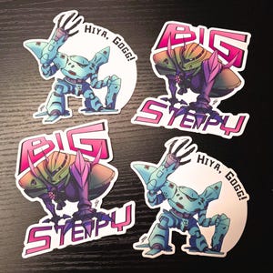 May include: Four stickers featuring robot illustrations. Two stickers show a light blue robot with the text "Hiya, Gogg!". The other two stickers show a purple and green robot with the text "Big Stempu".