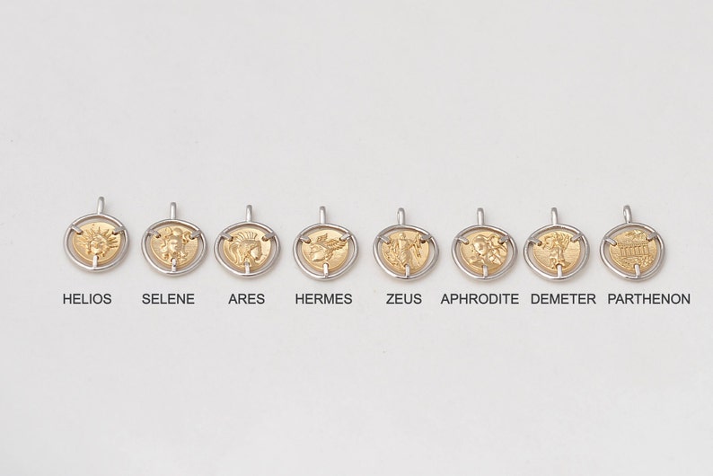May include: Eight gold-colored pendants with different Greek mythological figures and the Parthenon, each with a silver-colored ring around the edge. The pendants are labeled with their names: Helios, Selene, Ares, Hermes, Zeus, Aphrodite, Demeter, and Parthenon.