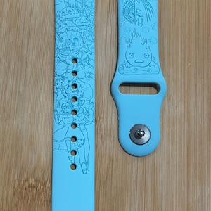 Anime themed, enchanting and magical characters engraved design on a silicone watch band compatible with Apple Watch and Galaxy Watch .