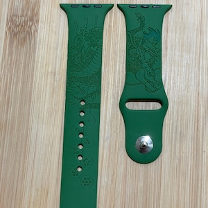 Anime dragon themed engraved design on a silicone watch band compatible with Apple Watch and Galaxy Watch .