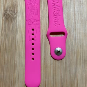 Anime themed, slayer girl character engraved design on a silicone watch band compatible with Apple Watch and Galaxy Watch .