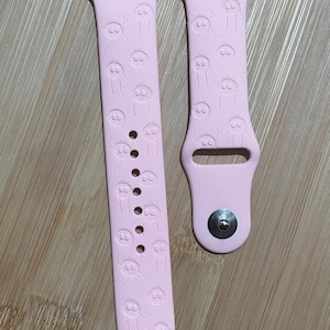 Anime themed, enchanting and magical characters engraved design on a silicone watch band compatible with Apple Watch and Galaxy Watch .