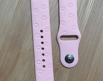 Anime themed, enchanting and magical characters engraved design on a silicone watch band compatible with Apple Watch and Galaxy Watch .