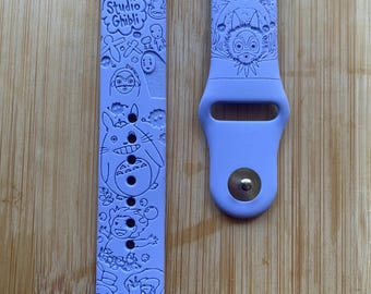 Anime themed, enchanting and magical characters engraved design on a silicone watch band compatible with Apple Watch and Galaxy Watch .