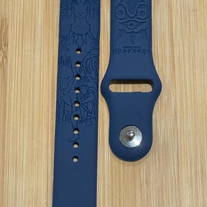 Anime themed, enchanting and magical characters engraved design on a silicone watch band compatible with Apple Watch and Galaxy Watch .