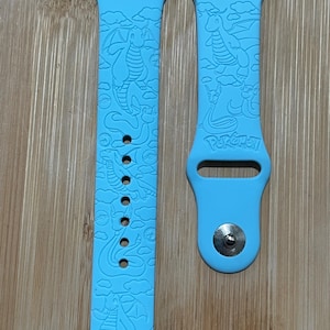 Anime themed dragon type character engraved design on a silicone watch band compatible with Apple Watch and Galaxy Watch .